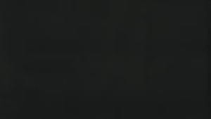Dark charcoal textured background with subtle, barely visible patterns