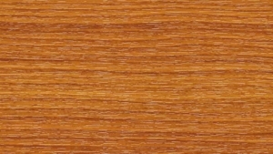 Close-up of warm honey-brown wood grain with fine horizontal lines to convey the texture of the surface.