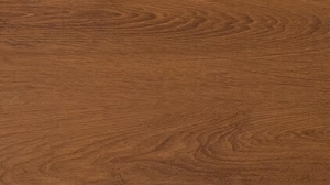 Close-up of a brown wooden tabletop with visible grain patterns, showing warm brown tones and natural texture.