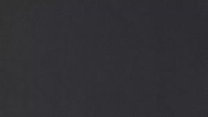 Dark charcoal textured background with subtle grain and speckle texture.