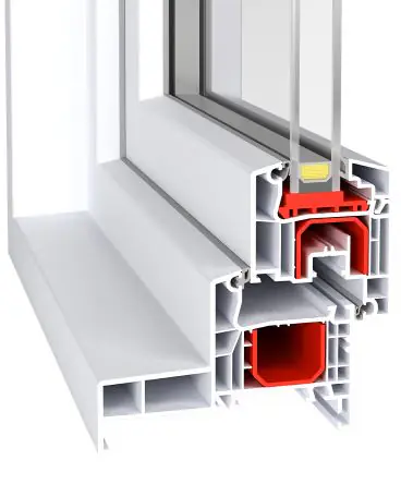 Cross-section of a window frame profile showing multiple hollow chambers, a red insulating core/gasket, and a glass pane.