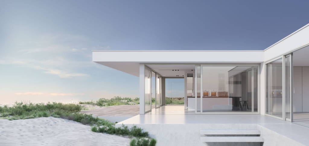 Modern white building with large glass windows and a cantilevered terrace along a sandy, dune-filled seaside landscape.