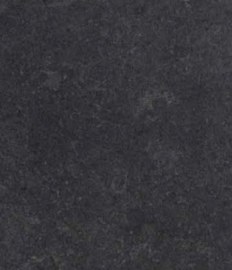Close-up of a dark, rough-textured surface resembling asphalt or pavement.