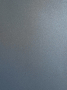 Close-up of a blue-gray textured surface with tiny pebble-like grain (leather-like material).