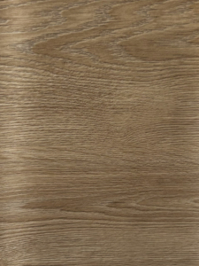 Close-up of brown wood grain with subtle knots and warm finish, resembling a tabletop surface