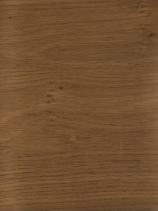 Close-up of a brown wooden surface showing prominent grain patterns and knots