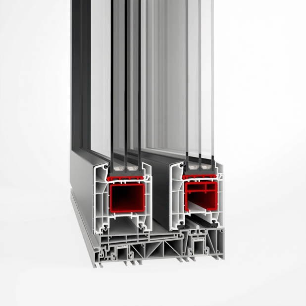 Cross-section of a double-glazed aluminum window frame showing insulating chambers and red seals.